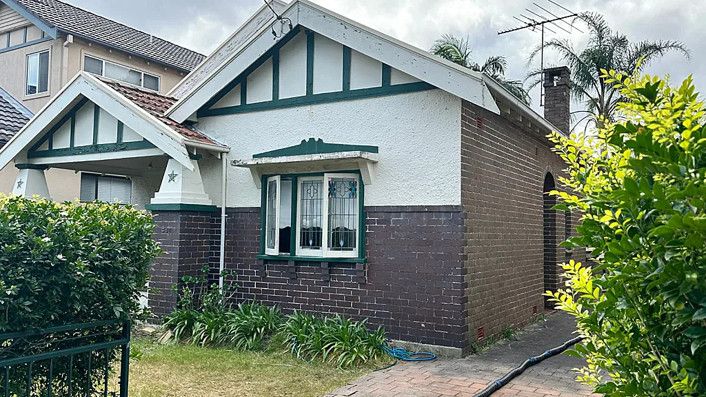 Hidden Downpipe Behind 10 Years of Cracks